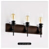 e95c0112-d3fc-441d-9514-5860f0334d73.jpg DOMETOUR 3-Light Black & Wood Vanity Light – Modern Glass Shade Bathroom Fixture